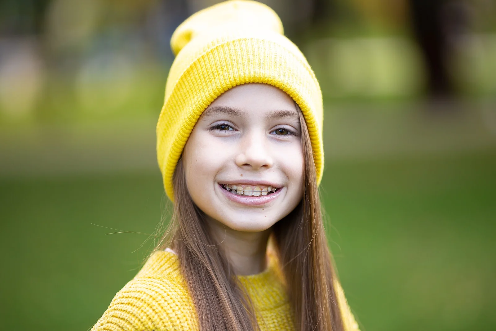 A smiling child wearing braces